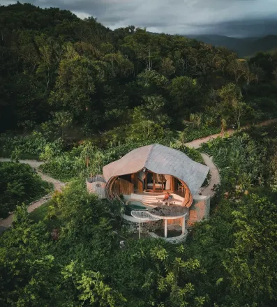 Stunning drone shot of surfers waiting for waves in the clear waters of Hawaii.
