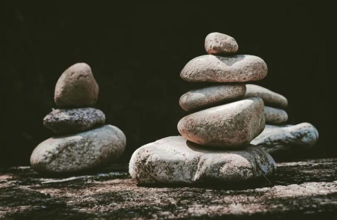Stunning drone shot of surfers waiting for waves in the clear waters of Hawaii.